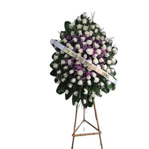 Corona fúnebre con rosas blancas y orquídeas hawaianas
