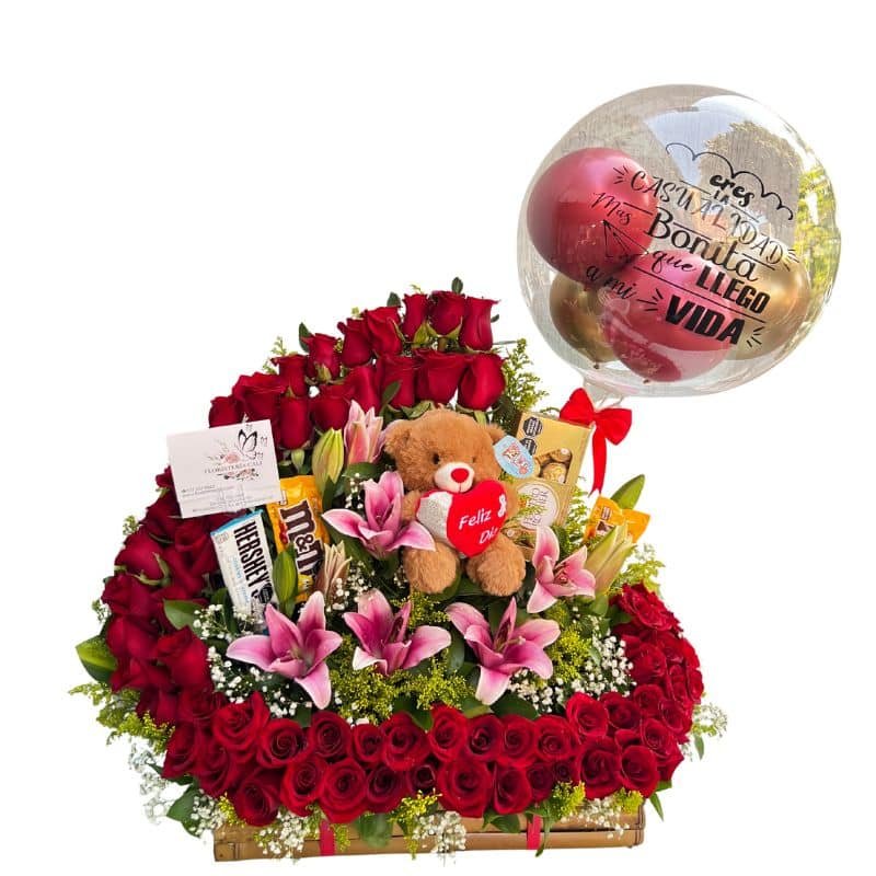 Canasta bailarina con 80 rosas, lirios, chocolates y globo burbuja personalizado.
